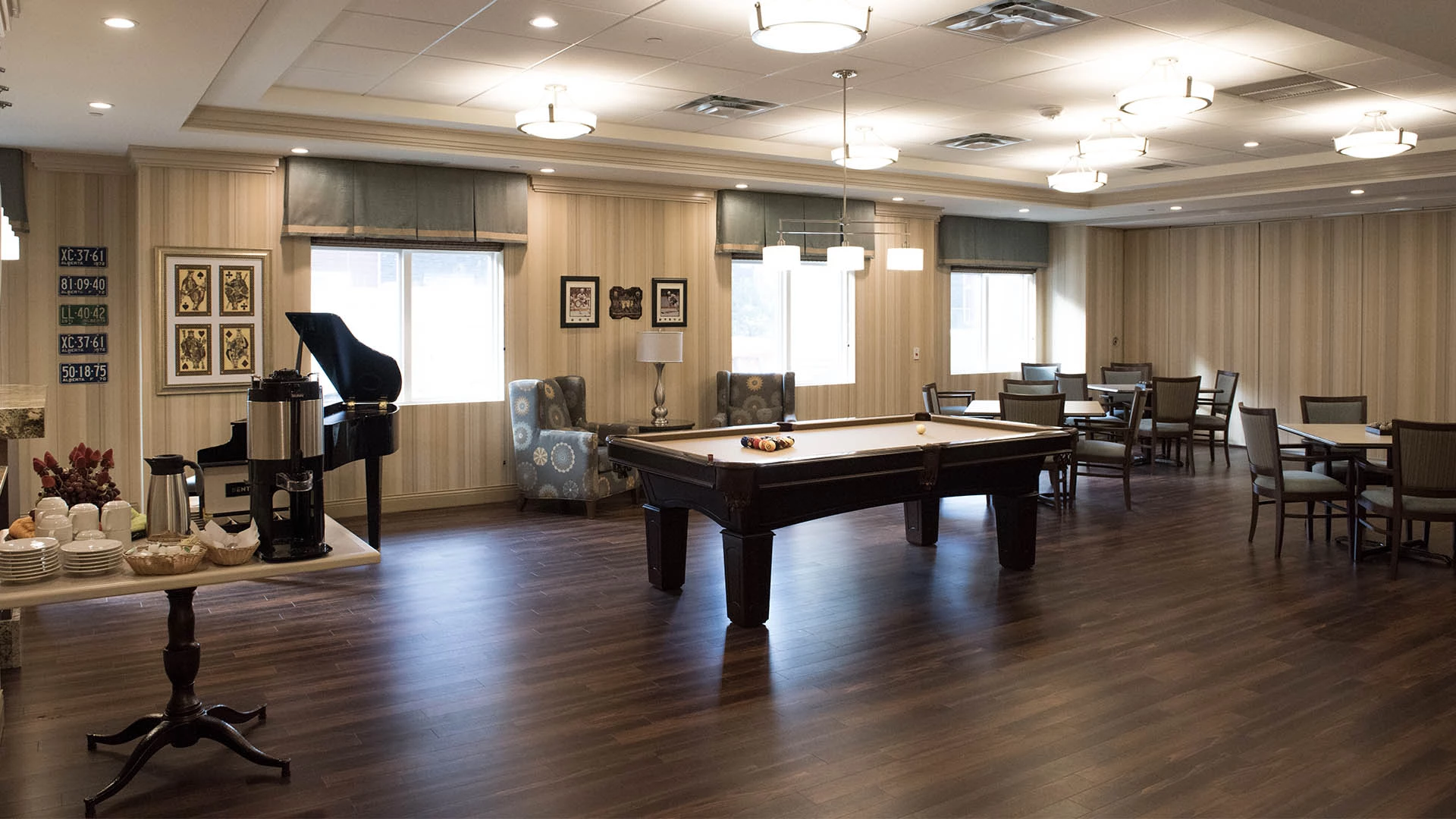 Game room with pool table at MacTaggart Place senior apartments